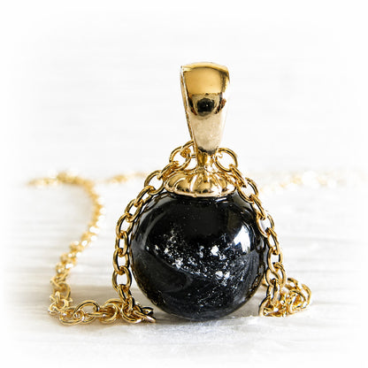 14k gold pendant with a small black cremation marble hand-made in Arizona