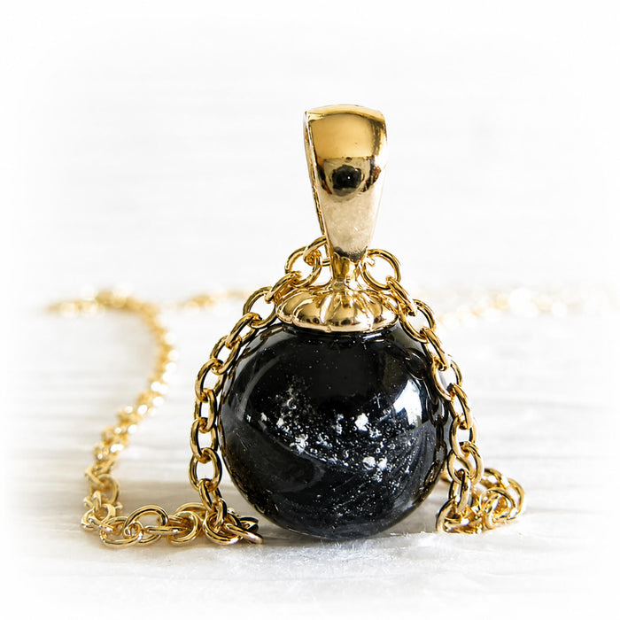 14k gold pendant with a small black cremation marble hand-made in Arizona