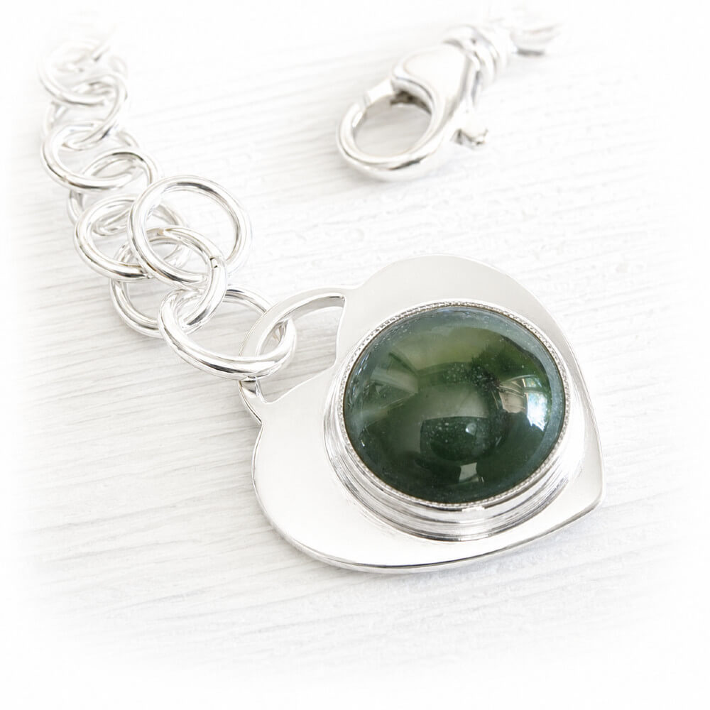 Handmade sterling silver charm bracelet with a memorial glass focal cabochon set on a silver heart
