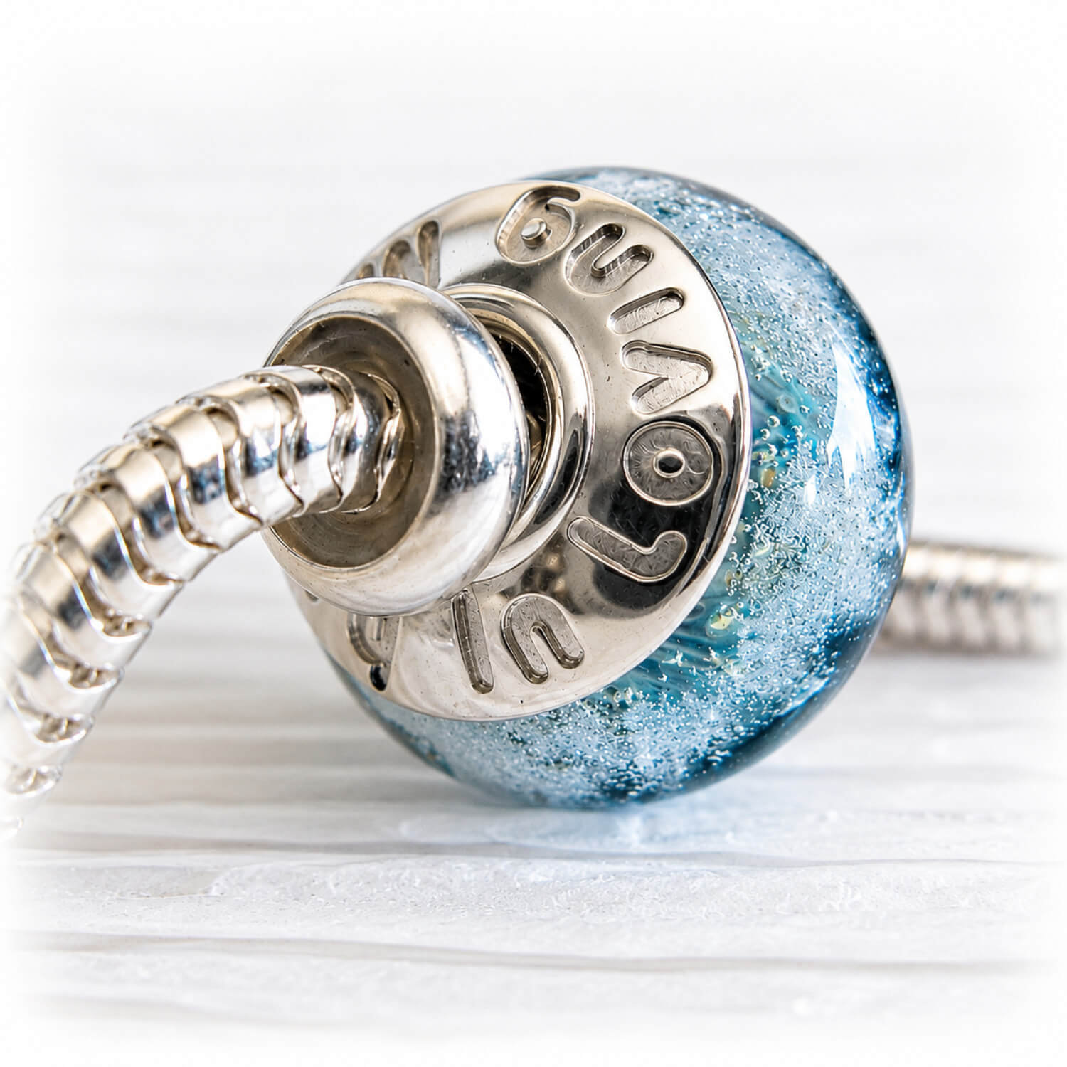 Handcrafted glass memorial charm bead on a sterling silver snake chain with a silver spacer bead
