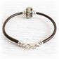 Brown leather charm bracelet with a sterling silver lobster clasp together with a pet memorial bead