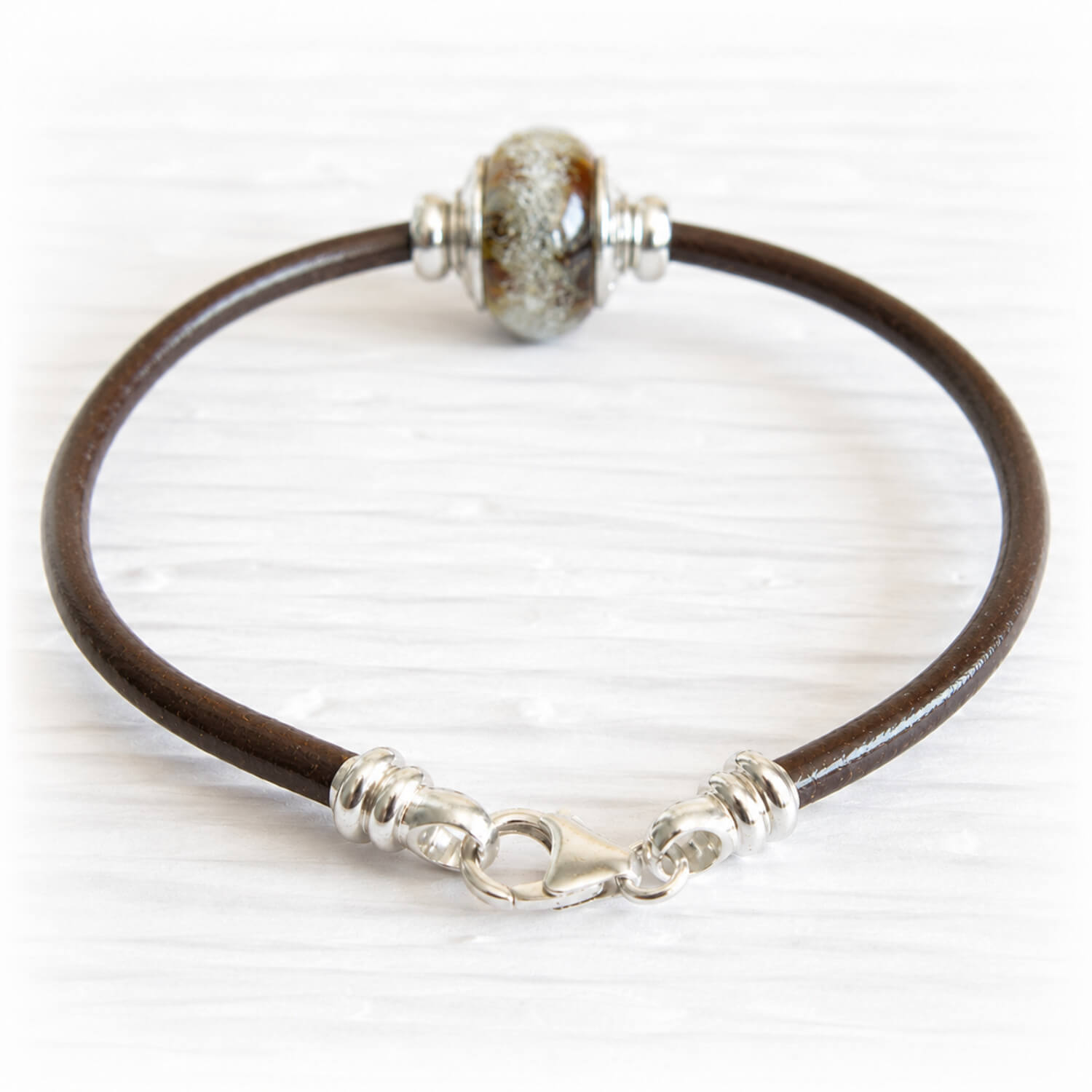 Brown leather charm bracelet with a sterling silver lobster clasp together with a pet memorial bead