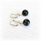 Black glass memorial marbles encasing cremation ashes on sterling silver leaver back earrings