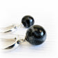 Cremation ashes sealed in black glass marbles set on sterling silver leaver back earrings