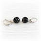 Pair of sterling silver memorial earrings with black glass marbles mixed with cremation ashes
