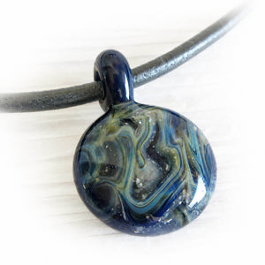 Memorial glass pendant hand blown from Lapis glass and swirls of cremation ashes