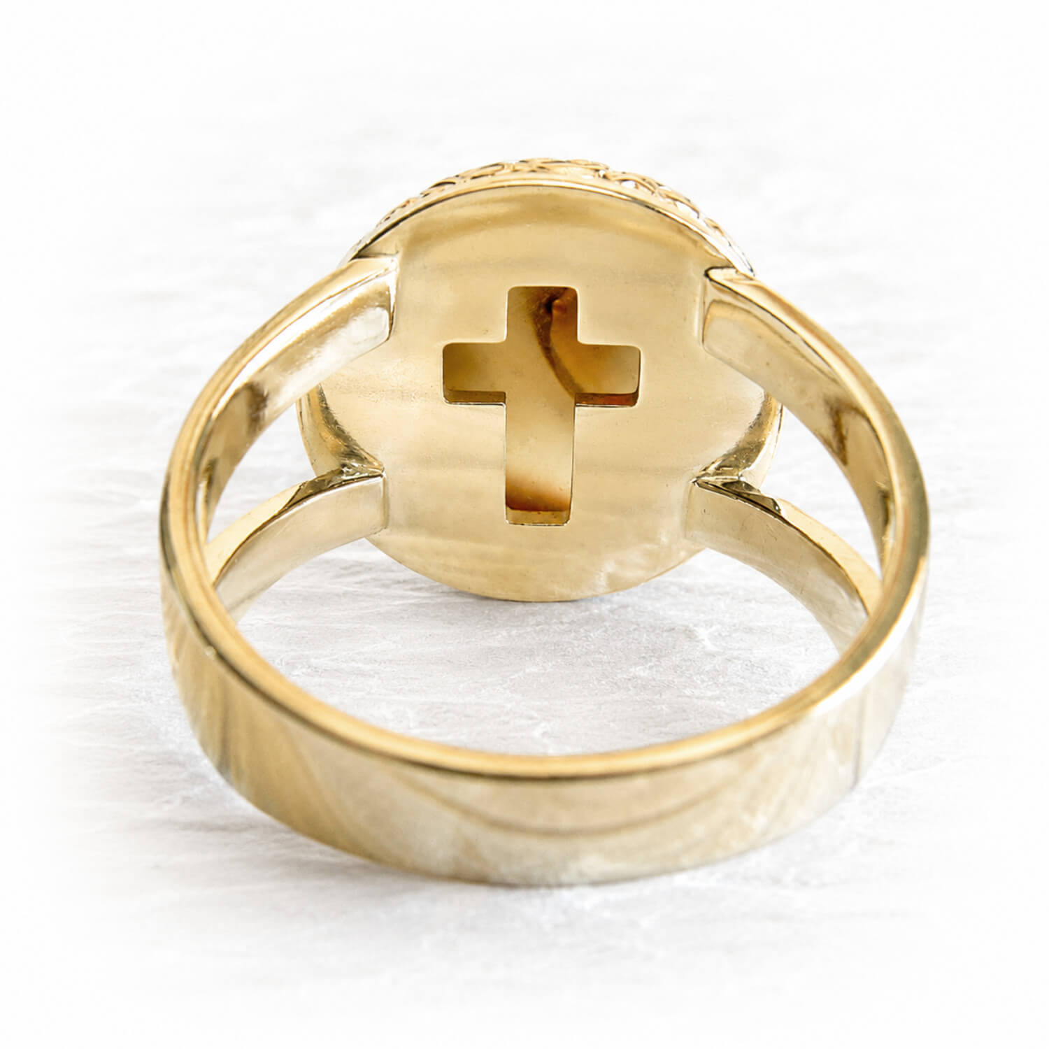 14k solid gold memorial ring with a cross design on the back