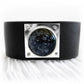 Black leather cuff bracelet with a black glass dome centered on a sterling silver square