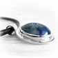 Sterling silver remembrance pendant with blue a handcrafted ash-infused glass cabochon and a black leather necklace