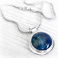 Sterling silver cremation pendant with handcrafted ash-infused blue glass cabochon