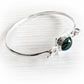 Polished sterling silver bracelet with blue and green hand blown glass containing pet ashes