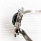 Sterling silver memorial bracelet with an antique finish featuring a glass gem infused with cremation ashes