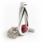 Brightly colored cremation marble infused with ashes set in a hand made polished sterling silver teardrop pendant 