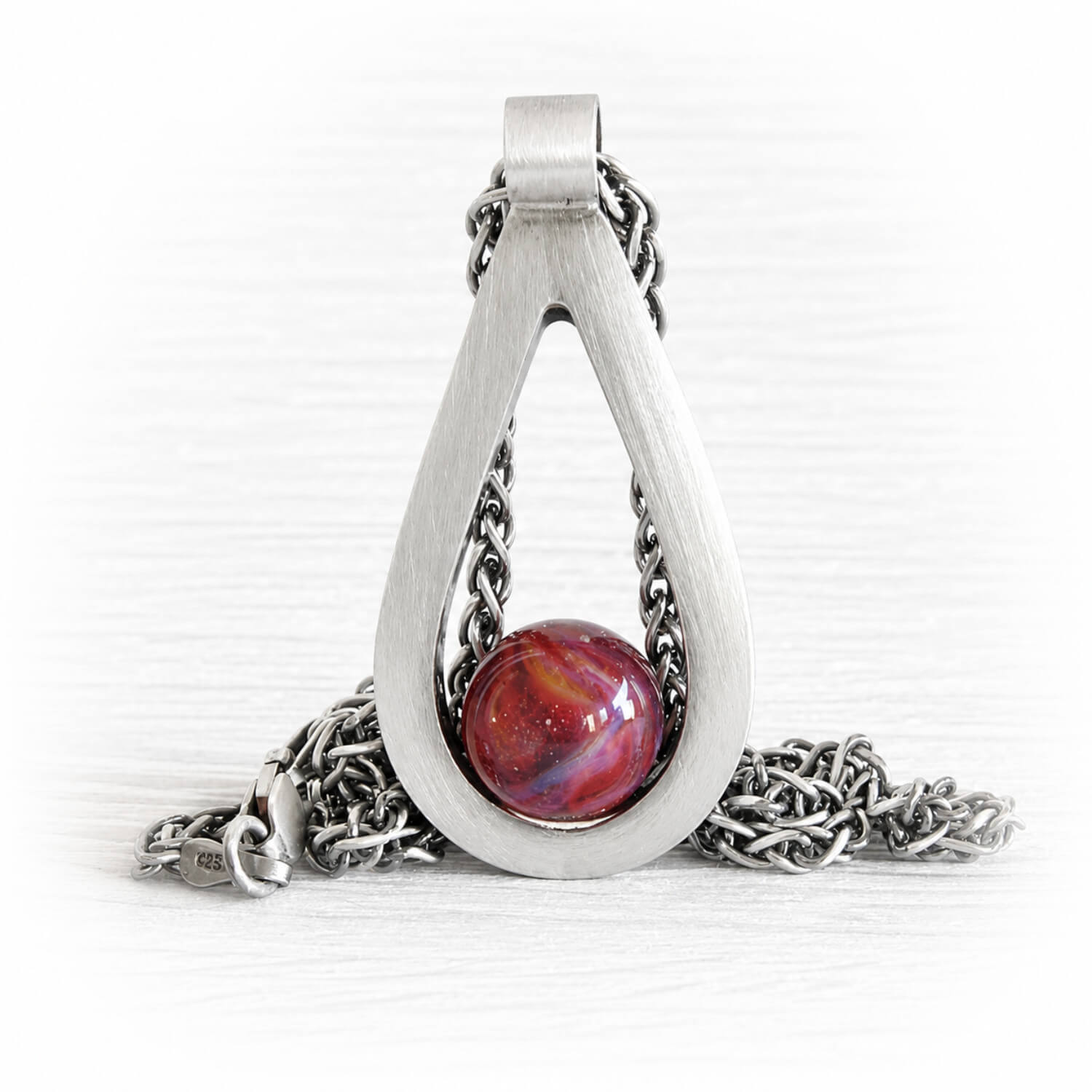 Sterling silver memorial teardrop pendant with a brushed finish and a handcrafted glass centerpiece