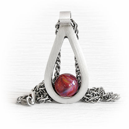 Sterling silver memorial teardrop pendant with a brushed finish and a handcrafted glass centerpiece