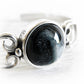Artisan crafted black cremation glass center piece on a sterling silver cuff bracelet