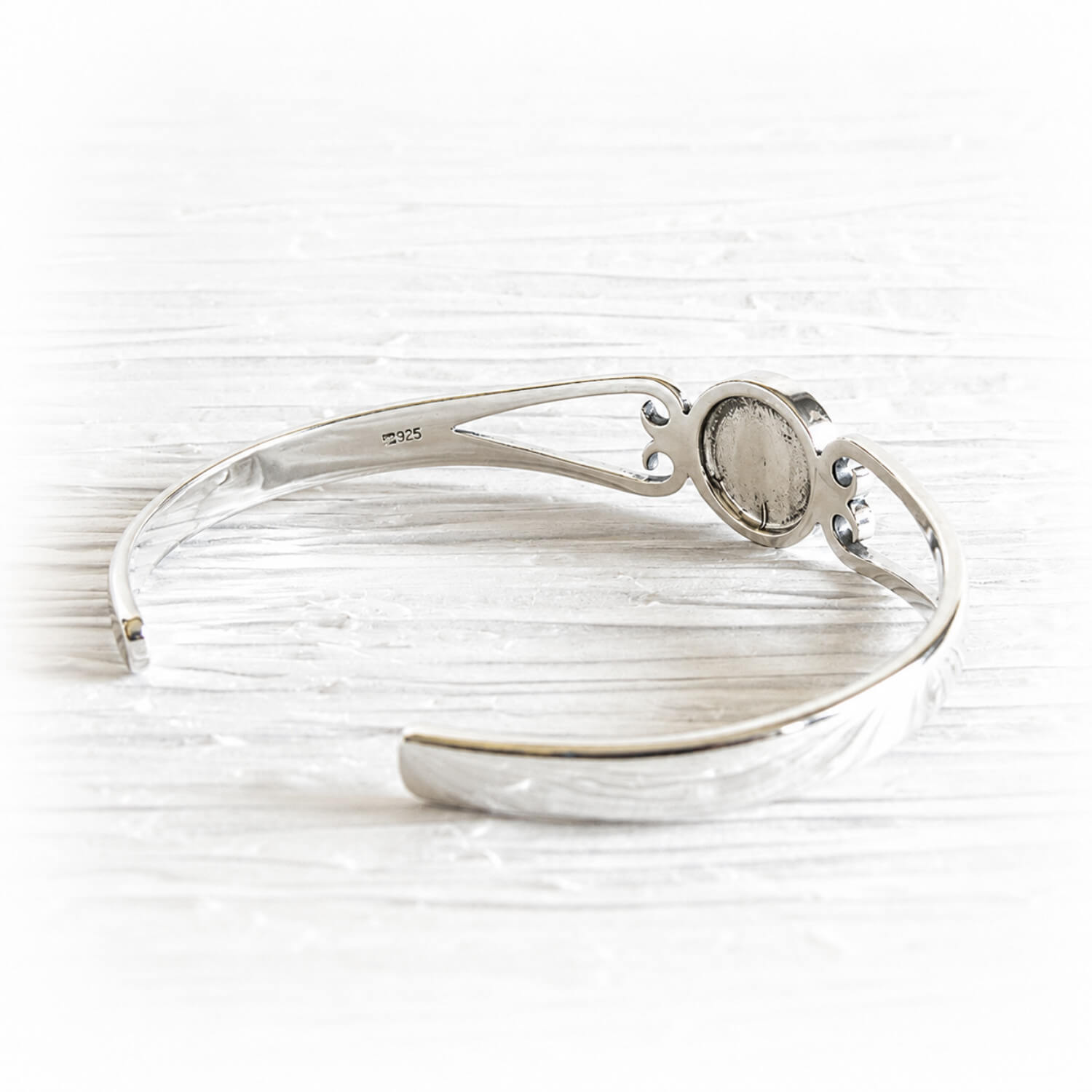 Back side view of a sterling sterling silver memorial cuff bracelet with a .925 hallmark