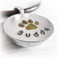 Sterling silver pendant with paw print and personalized 'Buddy' engraving
