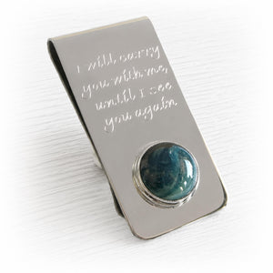 Men's memorial money clip handcrafted from sterling silver displaying a hand blown glass cabochon infused with cremation ashes