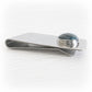 Sterling silver money clip including a hand blown glass cabochon with cremation ashes sealed within the glass