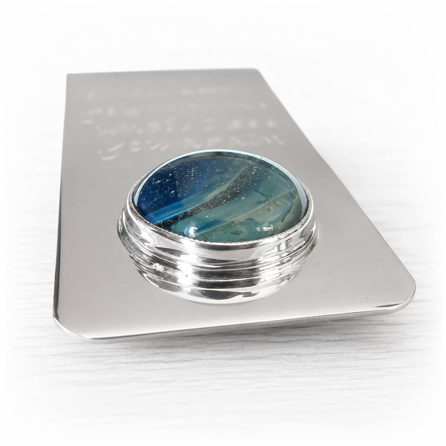 Sterling silver memorial money clip displaying a blue and aqua hand blown swirled glass cabochon 