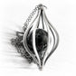 Sterling silver pet memorial with an antique finish displaying ashes encased in a handmade glass marble 
