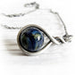 Antiqued sterling silver remembrance necklace together with a dark blue glass cremation marble 