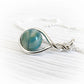 Sterling silver pendant with an aqua and turquoise hand blown glass memorial marblel