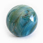 Turquoise and blue glass artisan-crafted into a keepsake memorial marble incorporating ashes