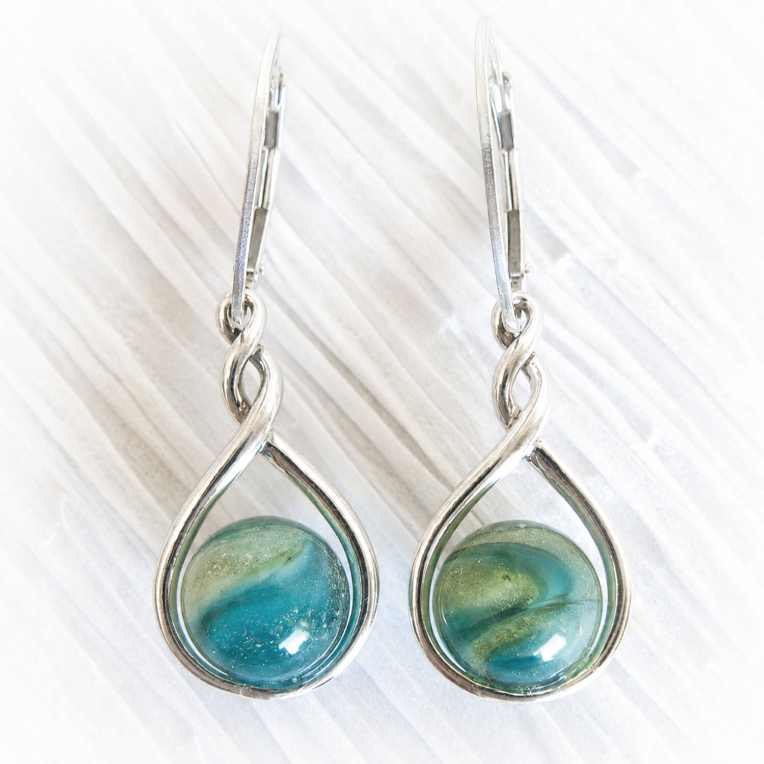 Green and turquoise glass marbles swirled with cremation ashes on polished sterling silver earrings 