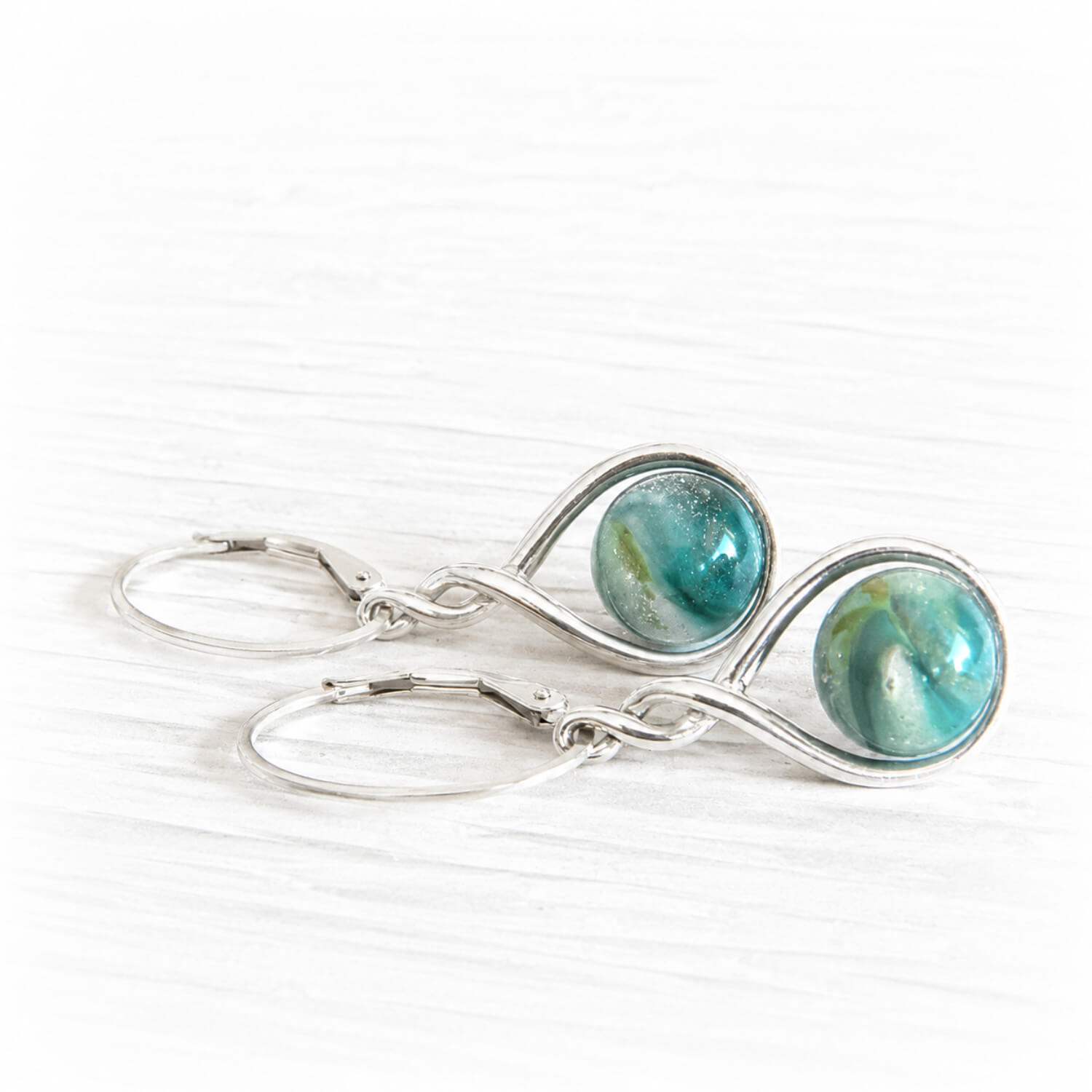 Small cremation marbles set on sterling silver earrings with silver leverback hooks