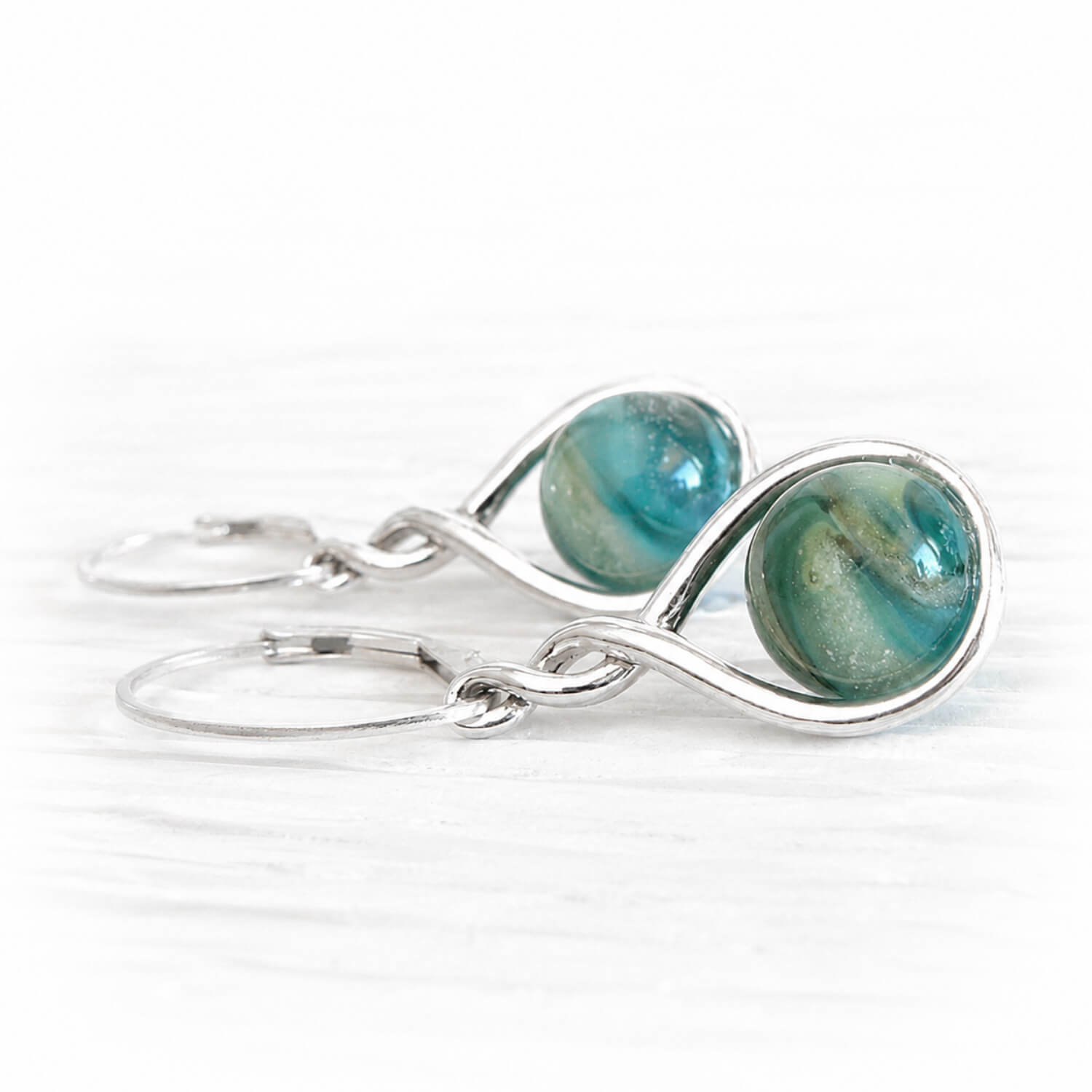 Turquoise and aqua cremation glass swirled with pet ashes set on sterling silver earrings with leverbacks 