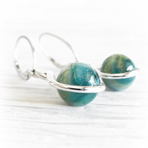 Ashes encased in aqua and turquoise hand blown glass marbles set in sterling silver memorial earrings 