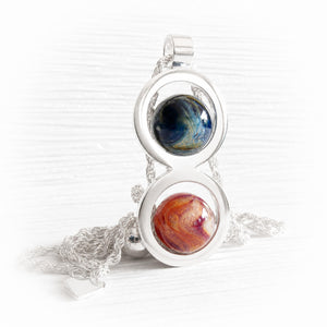 Ash infused glass marbles set in an artisan forged sterling silver memorial necklace