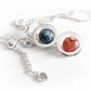 Sterling silver double ring pendant holding a pair of handmade glass marbled created using cremation ashes