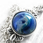 Glass memorial gem stone infused with pet ashes set in a dainty sterling silver necklace 