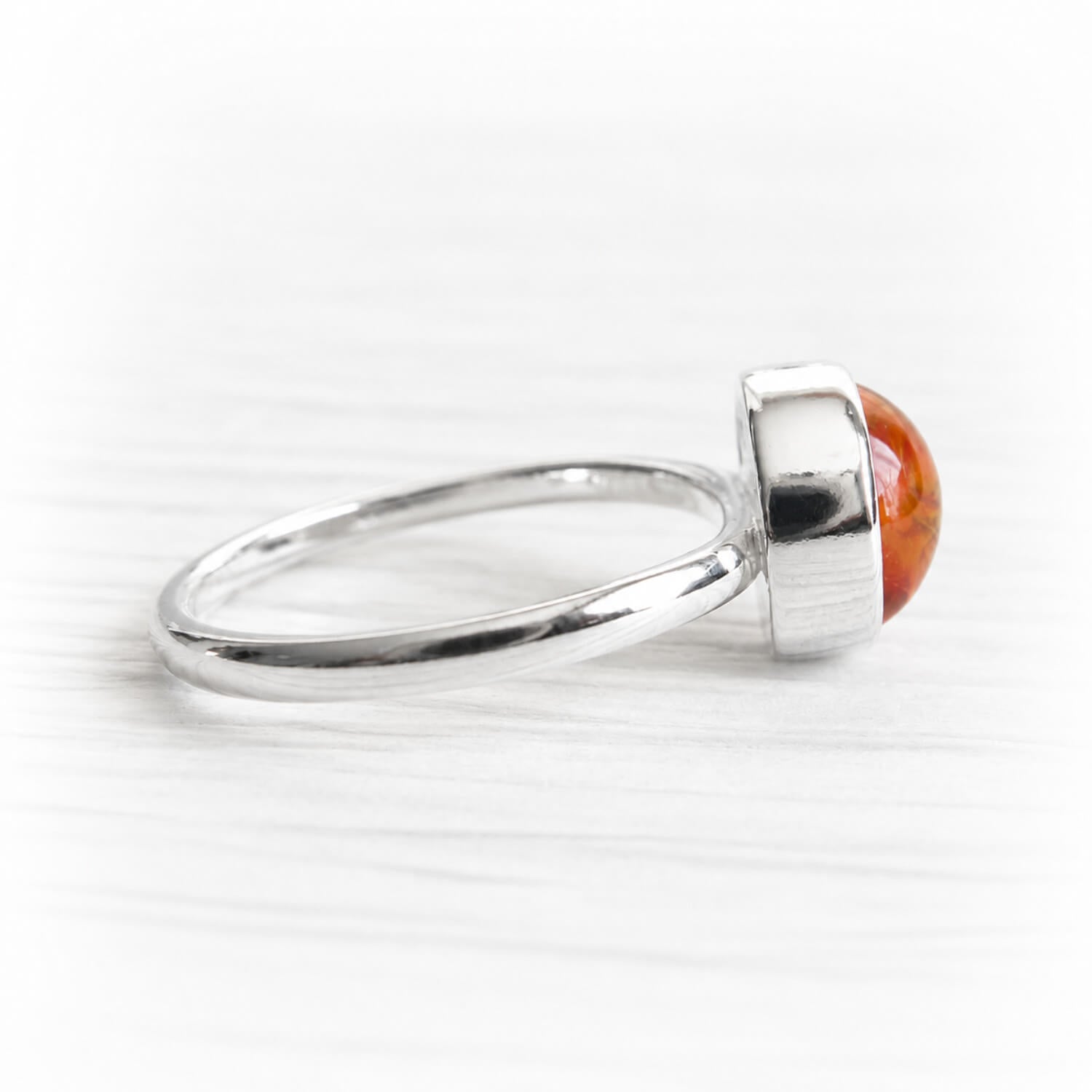 Hand blown glass infused with ashes set in a polished sterling silver ring