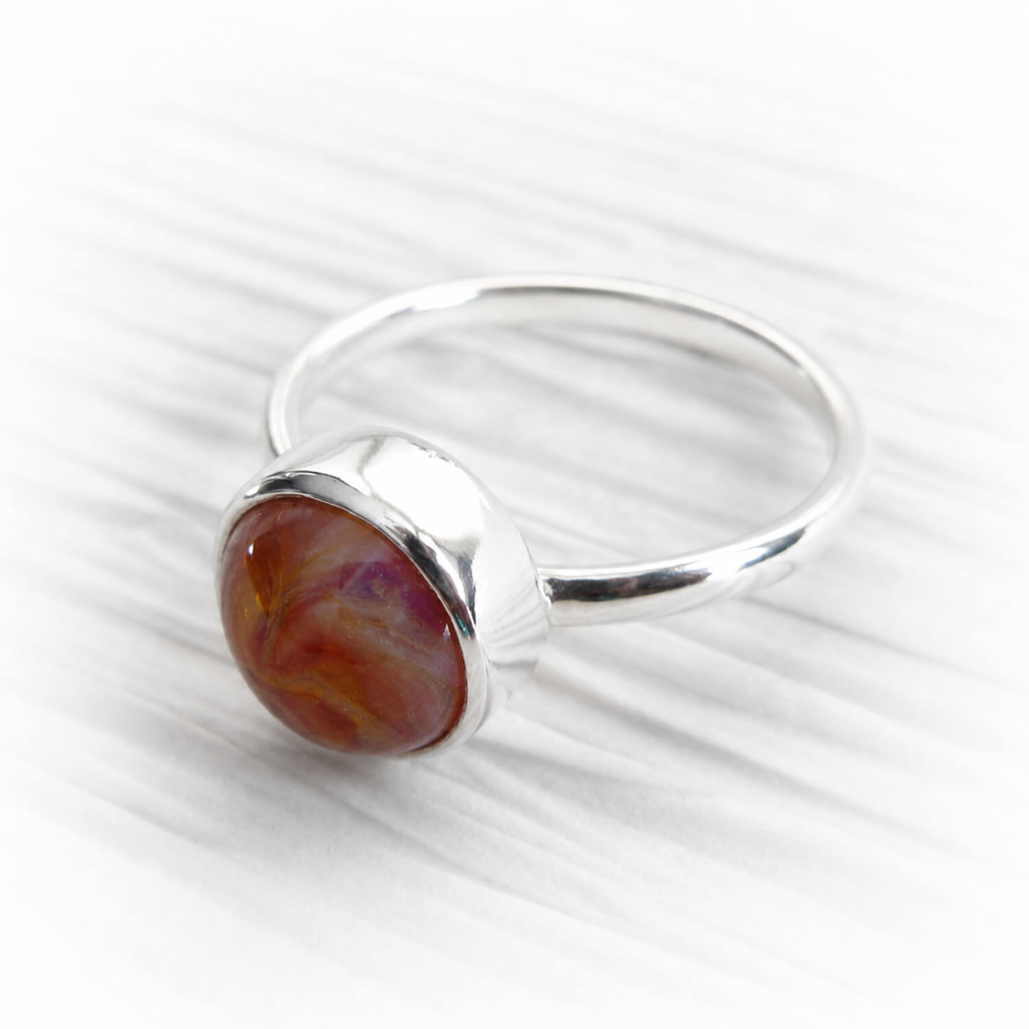 Artisan crafted cremation glass in a minimalist polished sterling silver memorial ring