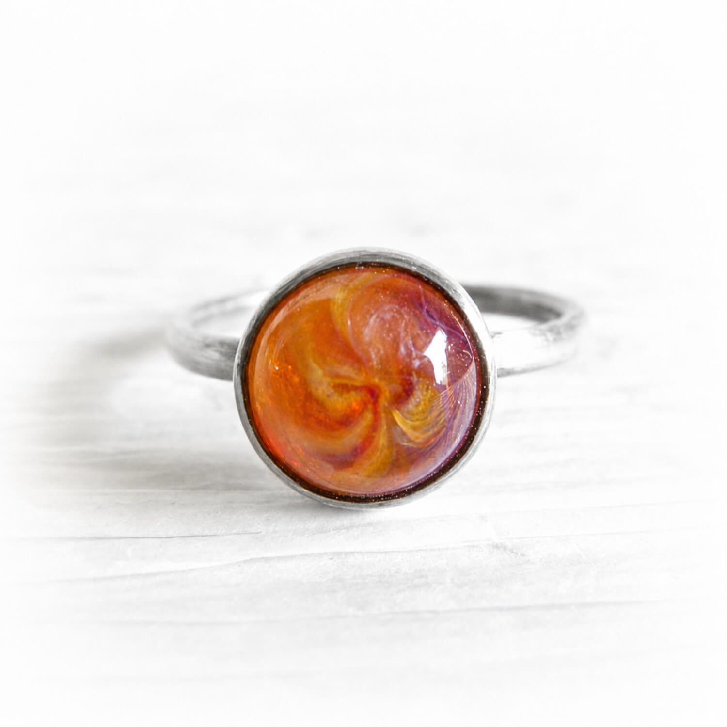 Artisan forged sterling silver memorial ring with a handcrafted glass centerpiece infused with pet ashes