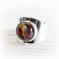 Colorful artisan crafted memorial ring made from hand forged sterling silver and hand blown glass