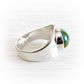 Handmade sterling silver remembrance ring with ashes permanently encased in a glass centerpiece