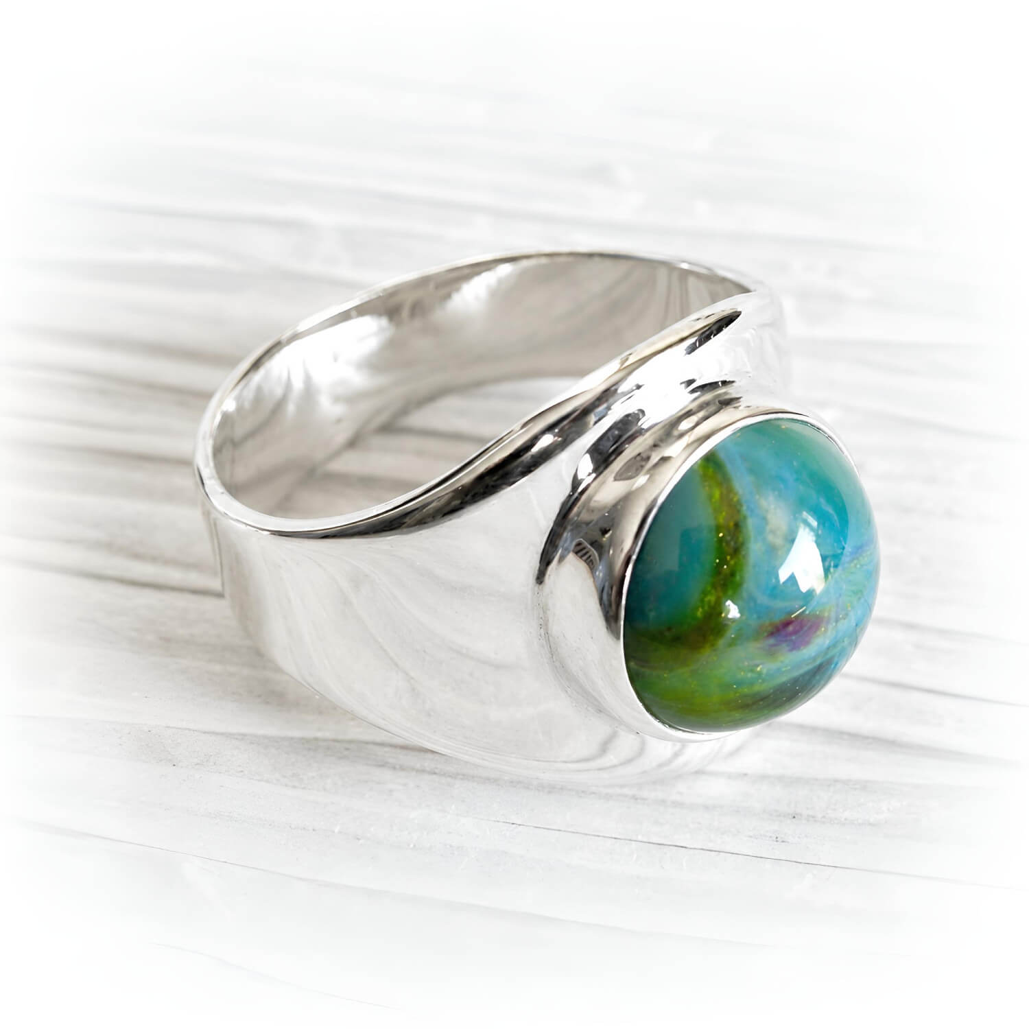 Artisan crafted sterling silver memorial ring with hand blown glass infused with cremation ashes
