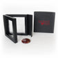 Black jewelry box with 'Locked in Art' branding, open to reveal a red and orange memory stone 