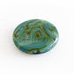 Handcrafted aqua and green glass memory stone keepsake incorporating ashes