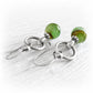 Pair of artisan made earrings featuring glass marbles encasing a loved ones cremation ashes in swirls of green glass