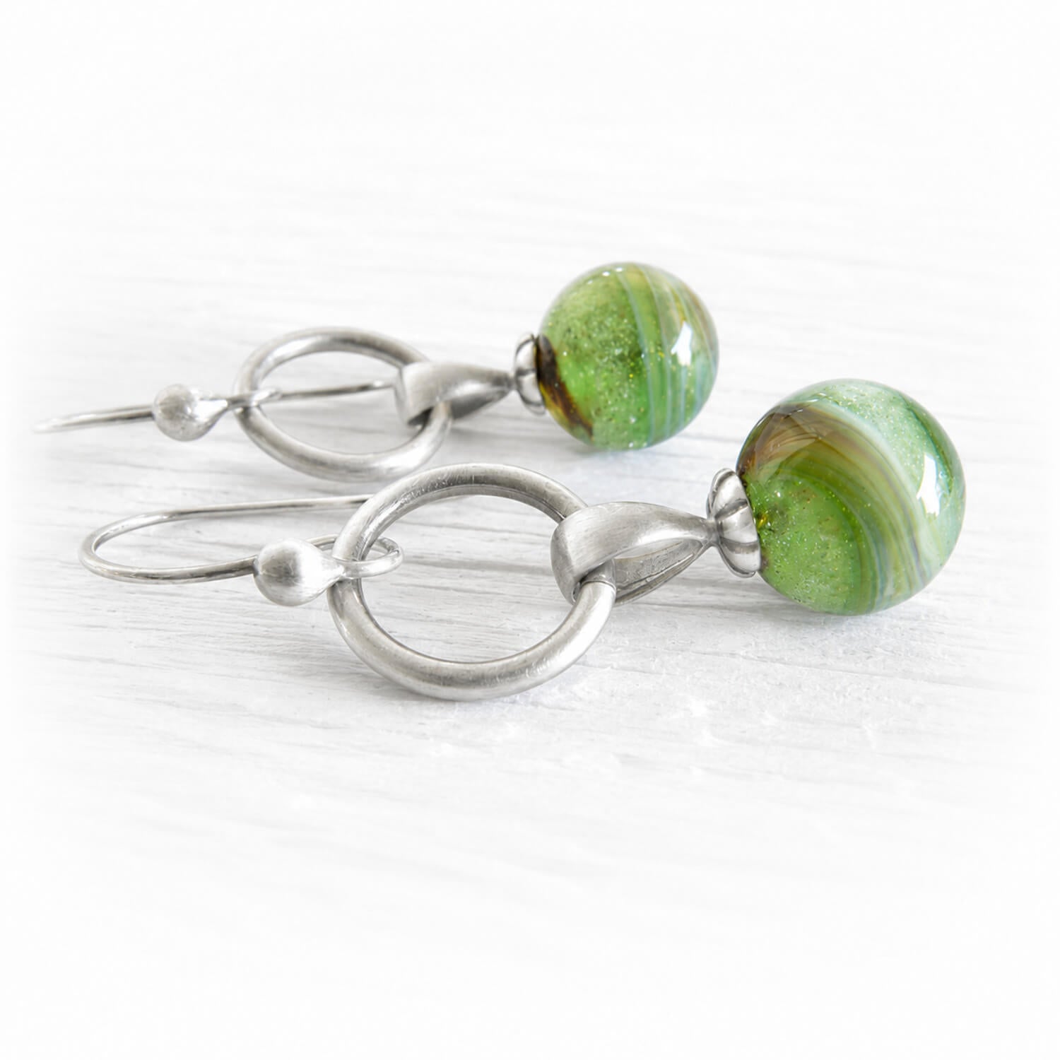 Green marbled bead earrings handcrafted with cremation ashes on sterling silver loops
