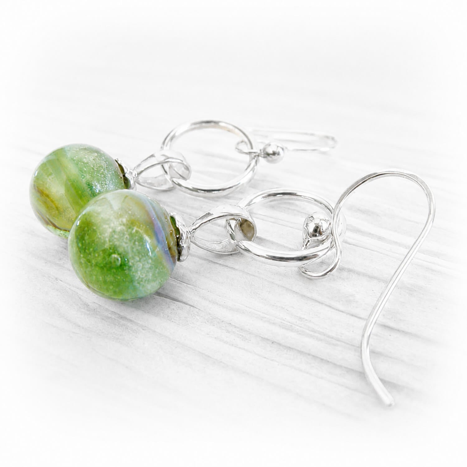Green marble earrings handcrafted with hand blown glass, sterling silver and cremation ashes