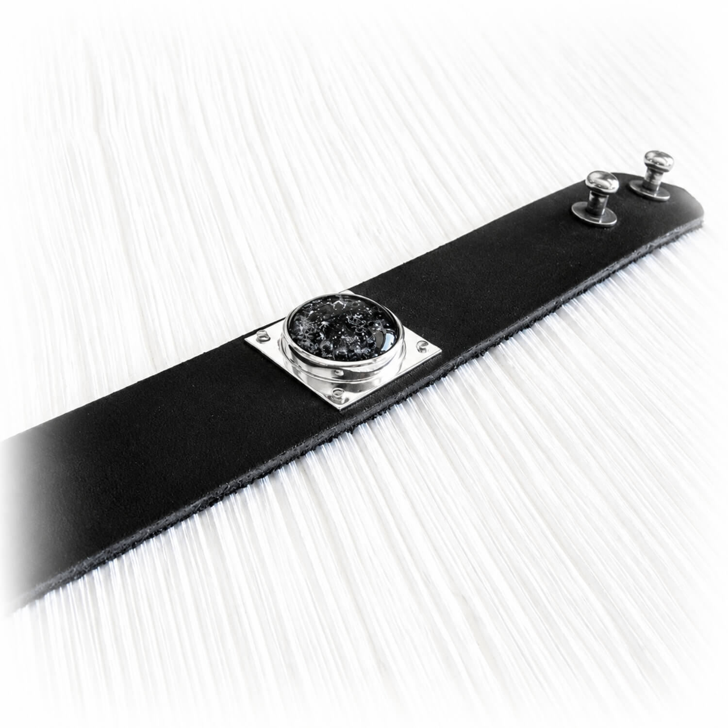 Handmade leather memorial cuff bracelet featuring artisan blown glass encasing cremation ashes
