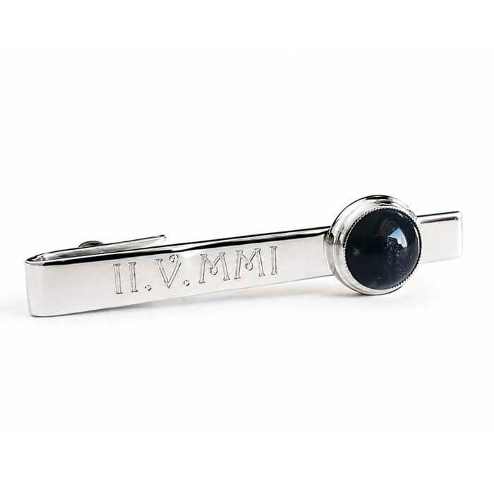 Custom engraved sterling silver men's tie bar with a black glass memorial cabochon on a white background 