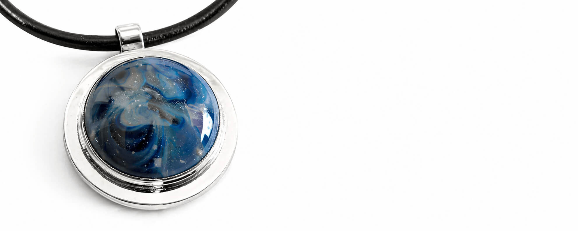 Glass cremation memorial pendant Necklace with a blue cabochon on a white background